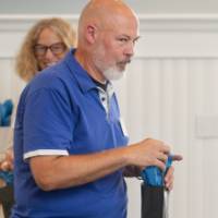faculty walking with their bag